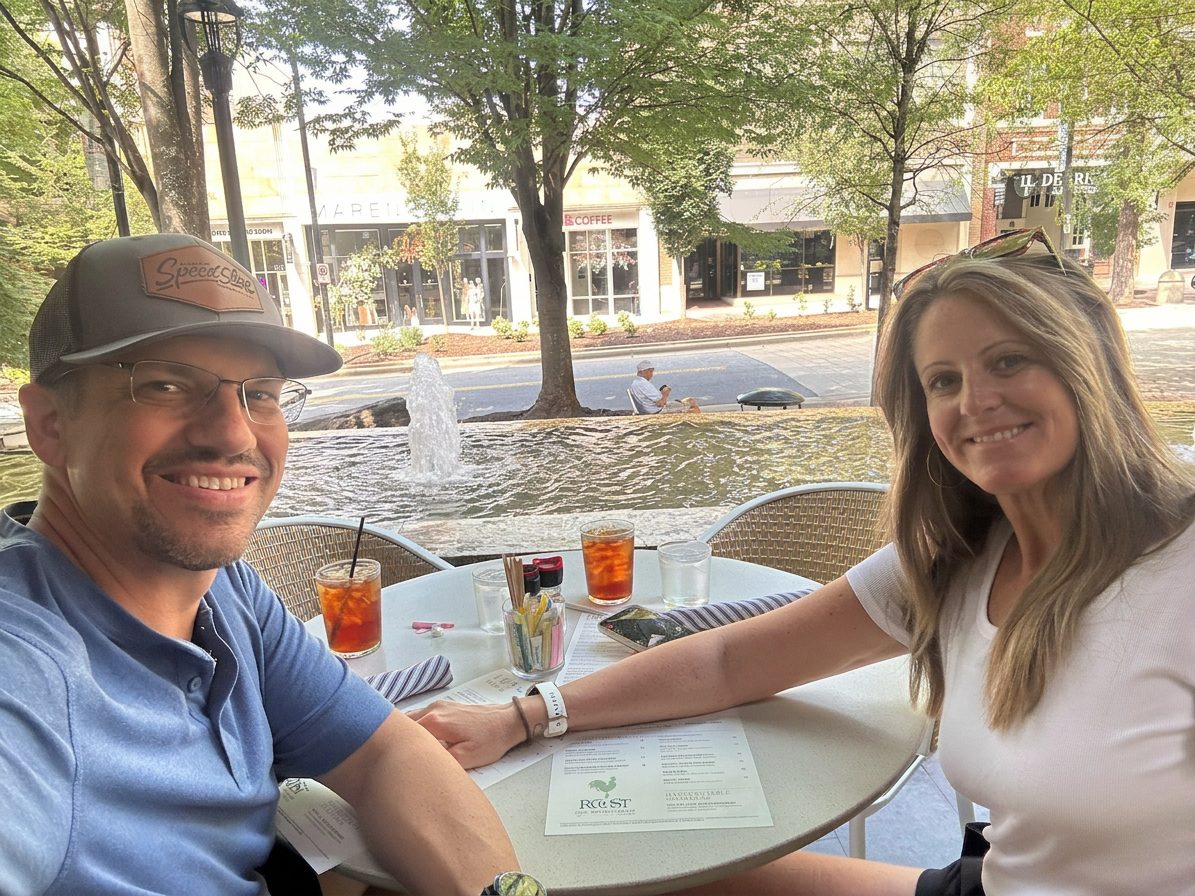 Stacey and Brad Shannon at an outdoor cafe table.